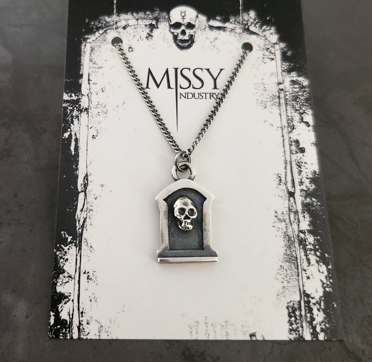 TOMBSTONE necklace with a skull