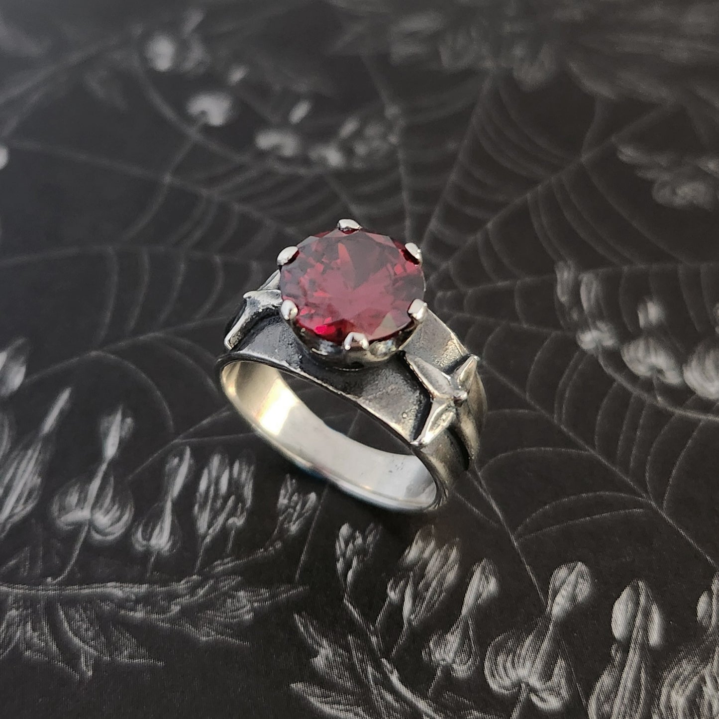 HELVETE ring with red cz