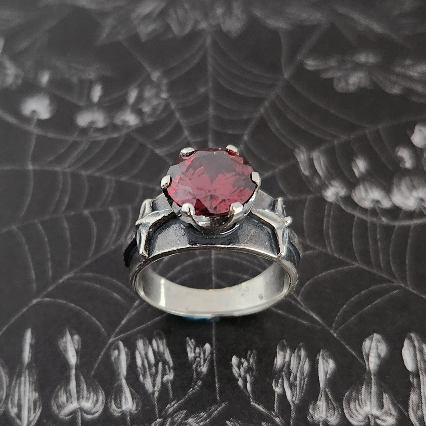 HELVETE ring with red cz