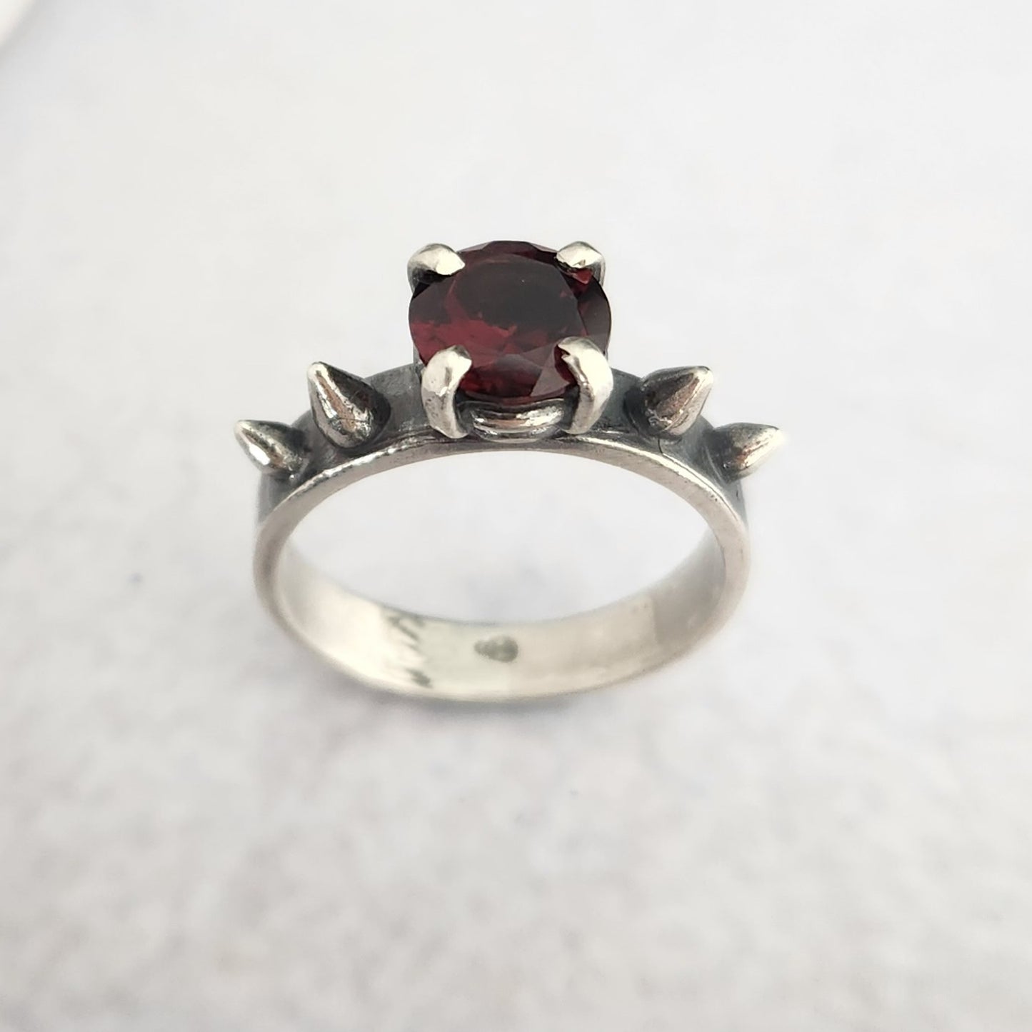 HURT ring with garnet