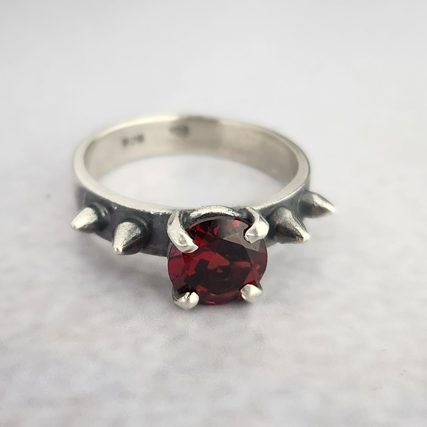 HURT ring with garnet