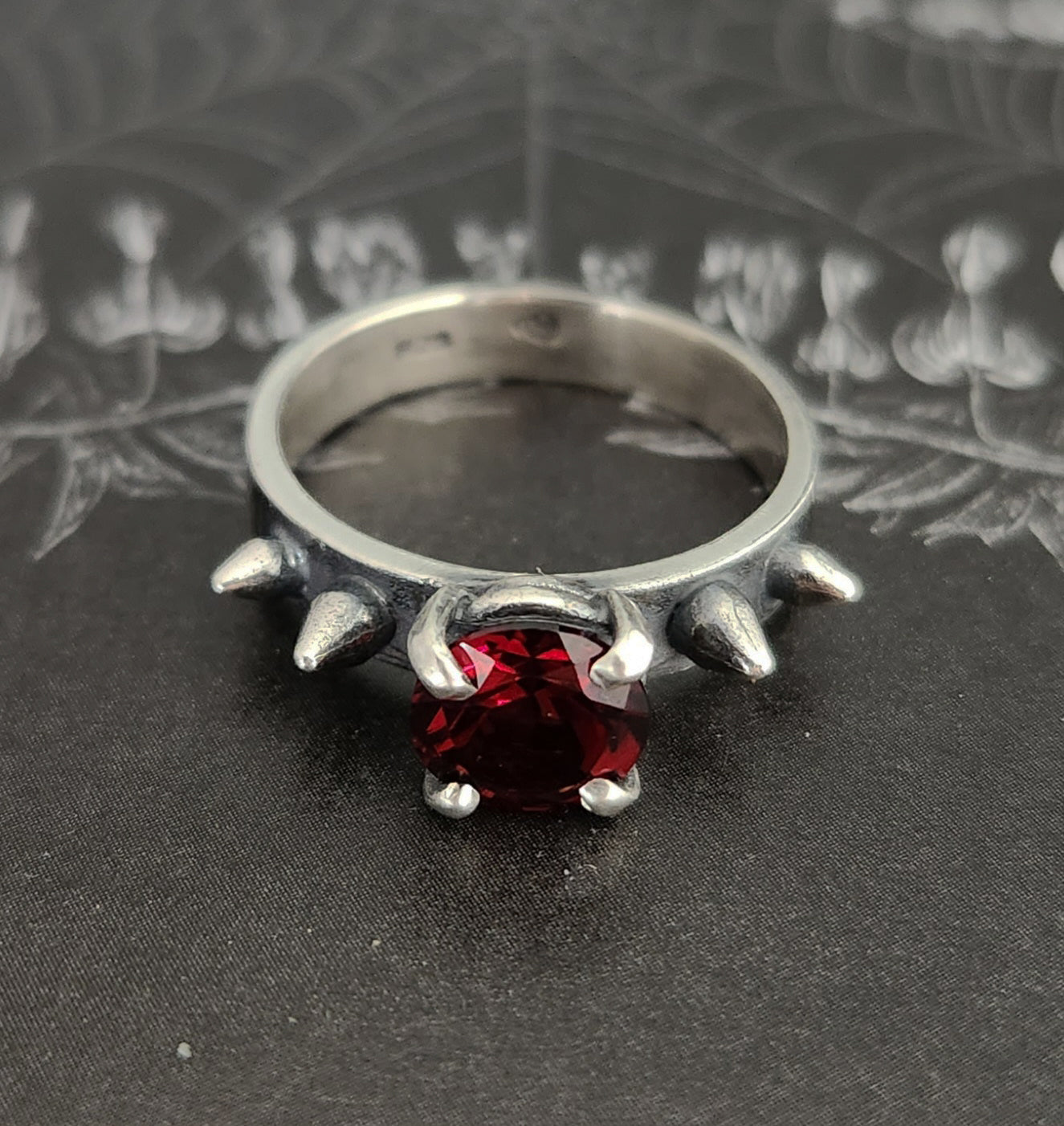 HURT ring with garnet