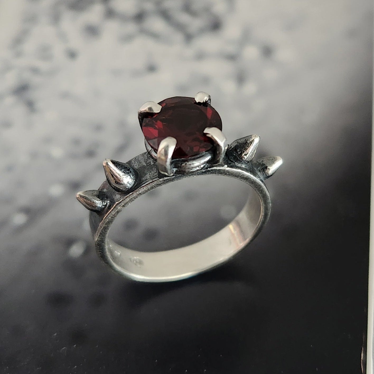 HURT ring with garnet