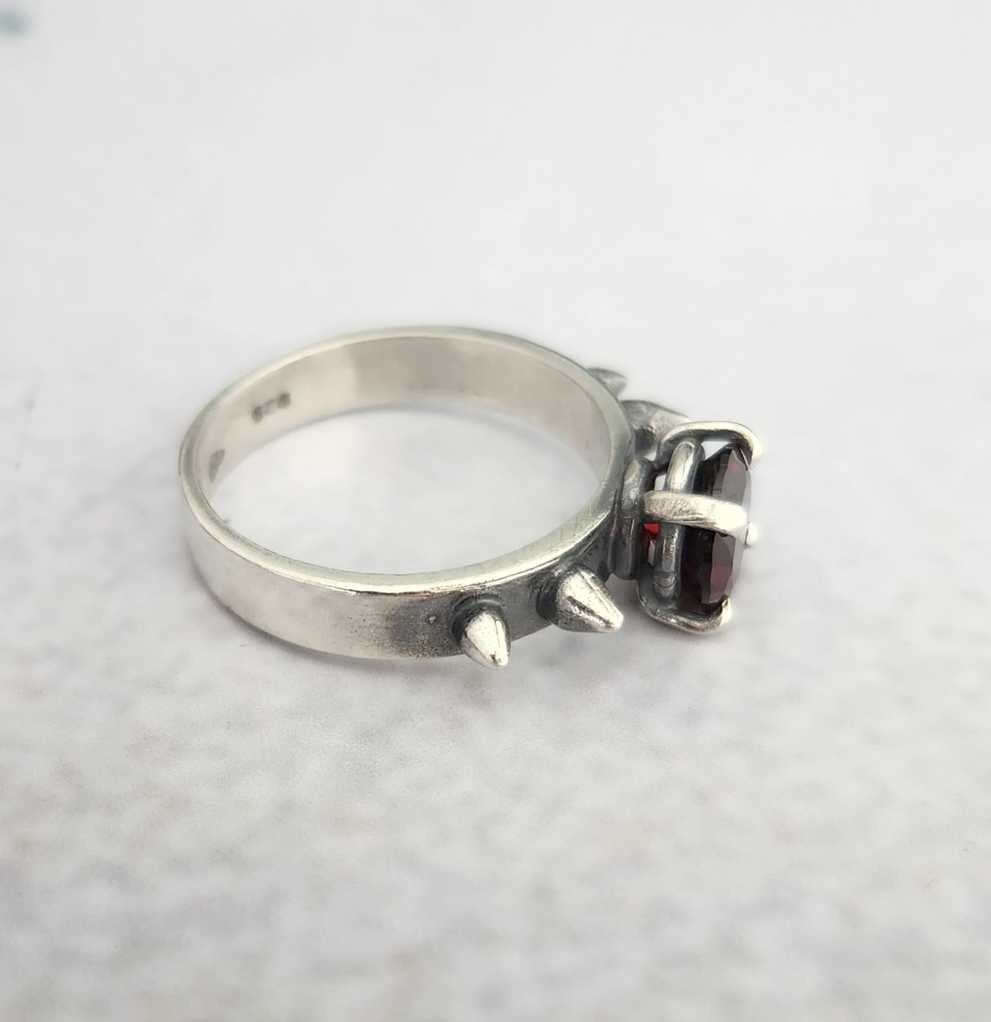 HURT ring with garnet